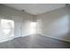 Spacious bedroom featuring wood-look flooring and neutral paint, offering a blank canvas at 170 Blaine St, Eustis, FL 32726