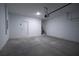 Clean garage interior with white walls and sealed concrete flooring at 170 Blaine St, Eustis, FL 32726
