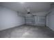Spacious garage with overhead door and concrete floor at 170 Blaine St, Eustis, FL 32726