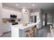 Modern kitchen featuring stainless steel appliances, white cabinets, and a stylish island at 170 Blaine St, Eustis, FL 32726