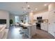 Bright, open kitchen with stainless steel appliances, a large center island, and counter stools at 170 Blaine St, Eustis, FL 32726