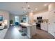 Bright, open kitchen with stainless steel appliances, a large center island, and counter stools at 170 Blaine St, Eustis, FL 32726
