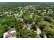 An aerial view outlines the property, highlighting its location among lush greenery, showcasing the neighborhood at 1710 Alvarado Ct, Longwood, FL 32779