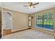Bedroom with natural light, large window, ceiling fan, and hardwood flooring at 1710 Alvarado Ct, Longwood, FL 32779