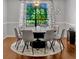 Dining room with large window and stylish chandelier at 1710 Alvarado Ct, Longwood, FL 32779