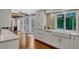 Bright kitchen with white cabinets, double sink, and hardwood floors at 1710 Alvarado Ct, Longwood, FL 32779