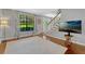 Living room featuring stairs and large window at 1710 Alvarado Ct, Longwood, FL 32779