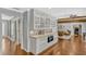 Open-concept living room featuring a built-in oven and hardwood floors at 1710 Alvarado Ct, Longwood, FL 32779