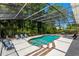Tranquil pool within a screened enclosure, featuring an outdoor lounge area with ample seating, perfect for entertaining at 1710 Alvarado Ct, Longwood, FL 32779