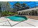 Beautiful in-ground pool within a screened enclosure, an outdoor bar, and a backyard retreat at 1710 Alvarado Ct, Longwood, FL 32779