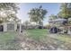 Spacious backyard with a storage shed, trampoline, gazebo, and outdoor seating for recreation and relaxation at 1905 Lady Ave, Ocoee, FL 34761