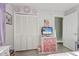 Bright bedroom features a closet, light gray walls, and decor at 1905 Lady Ave, Ocoee, FL 34761