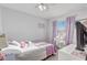 Bright bedroom with natural light and a charming vanity at 1905 Lady Ave, Ocoee, FL 34761