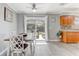 Bright dining area features hardwood floors, a view to the backyard, and a seamless connection to the kitchen at 1905 Lady Ave, Ocoee, FL 34761