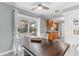 Bright dining area features hardwood floors, a view to the backyard and seamless connection to the kitchen at 1905 Lady Ave, Ocoee, FL 34761