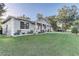Charming home with a well-maintained lawn, lovely front porch, and beautiful landscaping at 1905 Lady Ave, Ocoee, FL 34761
