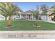 Charming home featuring a well-manicured lawn, vibrant landscaping, and two lovely palm trees at 1905 Lady Ave, Ocoee, FL 34761