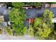 Well-maintained roof and mature landscaping is seen from above in this community at 207 Sweet Gum Way, Longwood, FL 32779