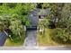 Birds eye view of a well maintained townhome featuring a driveway and mature palm trees at 207 Sweet Gum Way, Longwood, FL 32779