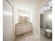 Bathroom featuring granite countertop vanity, modern fixtures and marble floors at 207 Sweet Gum Way, Longwood, FL 32779
