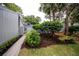 A cozy, well-maintained home is accentuated with manicured bushes and mulched beds at 207 Sweet Gum Way, Longwood, FL 32779