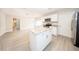 Renovated kitchen featuring granite countertops, stainless steel appliances and a center island at 207 Sweet Gum Way, Longwood, FL 32779