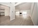 Bright, open living room featuring wood-look floors, a stone fireplace, and ample natural light at 207 Sweet Gum Way, Longwood, FL 32779