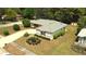 Aerial view of a lovely home surrounded by lush landscaping and a well-maintained lawn at 2100 Shirewood Ct, Winter Park, FL 32792