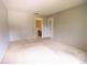 Neutral bedroom with high ceiling and ensuite bathroom and closet at 2100 Shirewood Ct, Winter Park, FL 32792