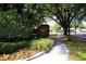 Welcoming entrance to Cedar Ridge community with lush greenery and inviting signage near the Dike Road street sign at 2100 Shirewood Ct, Winter Park, FL 32792