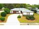 Charming home with a manicured lawn and beautiful curb appeal, showcasing a welcoming facade at 2100 Shirewood Ct, Winter Park, FL 32792