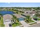 Beautiful aerial view of homes near a large lake, showcasing the neighborhood's serene environment and proximity to nature at 2907 Sime St, New Smyrna Beach, FL 32168