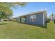 Backyard with a lawn and a covered porch at 2907 Sime St, New Smyrna Beach, FL 32168