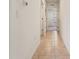 Hallway featuring tile flooring, white walls, and doorways leading to other rooms at 2907 Sime St, New Smyrna Beach, FL 32168