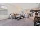 Spacious living area with plush carpeting, comfortable sofas, and easy access to the kitchen and dining at 2907 Sime St, New Smyrna Beach, FL 32168