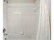 Bathroom features a shower and tub combination with white tile and a shower curtain at 2987 Sabel Oak Pl, Oviedo, FL 32765