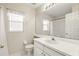 Bathroom features a single sink vanity, a toilet, and a shower with a curtain at 2987 Sabel Oak Pl, Oviedo, FL 32765