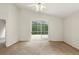 Bedroom with sliding glass doors leading to the outside screened patio and neutral colored carpet at 2987 Sabel Oak Pl, Oviedo, FL 32765