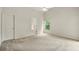 Bedroom featuring neutral carpet, tall ceilings, and a window with a view at 2987 Sabel Oak Pl, Oviedo, FL 32765