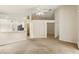 Open living room with view of kitchen and hall, neutral carpet, and high ceilings at 2987 Sabel Oak Pl, Oviedo, FL 32765