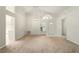 Bright living room with high ceilings, large windows, and tiled entryway at 2987 Sabel Oak Pl, Oviedo, FL 32765