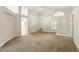 Spacious living room featuring high ceilings, neutral tones, and ample natural light at 2987 Sabel Oak Pl, Oviedo, FL 32765