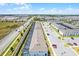 Aerial view of townhomes with swimming pools in screened-in lanais along the side of the building at 301 Jetty Way, Davenport, FL 33897