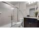 Bathroom featuring a glass shower, vanity with sink, and tiled floor at 301 Jetty Way, Davenport, FL 33897