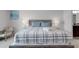 Relaxing bedroom featuring king size bed with neutral colors and coordinated decor at 301 Jetty Way, Davenport, FL 33897