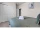 Bedroom features a neatly made bed, a closet with sliding doors, and neutral wall coloring at 301 Jetty Way, Davenport, FL 33897