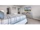 Bright bedroom featuring a king bed, TV, and dresser with coordinated decor at 301 Jetty Way, Davenport, FL 33897