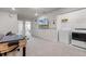Bonus room features a foosball table, TV, and laundry appliances for flexible space at 301 Jetty Way, Davenport, FL 33897