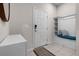 Welcoming entryway features a convenient bench with storage and a decorative mirror, enhancing functionality at 301 Jetty Way, Davenport, FL 33897