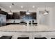 Close-up of the expansive kitchen island with granite countertops, perfect for meal preparation and casual dining at 301 Jetty Way, Davenport, FL 33897